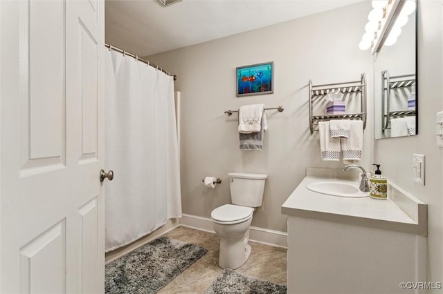 183 Nimcock Rd, Urbanna, VA 23175 - full bathroom featuring vanity, toilet, a shower with curtain, and baseboards