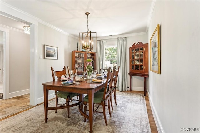 183 Nimcock Rd, Urbanna, VA 23175 - dining space featuring a chandelier, baseboards, and ornamental molding