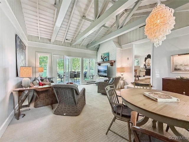 183 Nimcock Rd, Urbanna, VA 23175 - living room featuring carpet, high vaulted ceiling, beamed ceiling, a chandelier, and baseboards