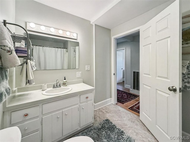 183 Nimcock Rd, Urbanna, VA 23175 - full bath with toilet, vanity, and baseboards