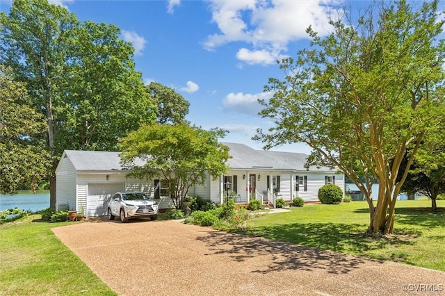 183 Nimcock Rd, Urbanna, VA 23175 - ranch-style home with an attached garage, concrete driveway, and a front lawn