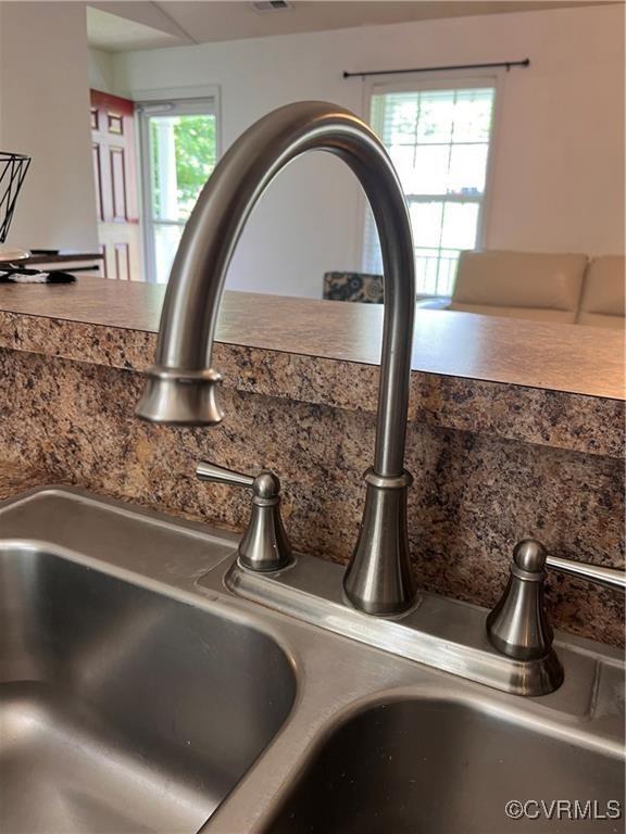 2212 Sara Ann Ct, Aylett, VA 23009 - kitchen view of a sink and decorative backsplash
