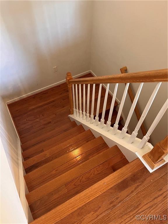 2212 Sara Ann Ct, Aylett, VA 23009 - staircase with wood finished floors and baseboards
