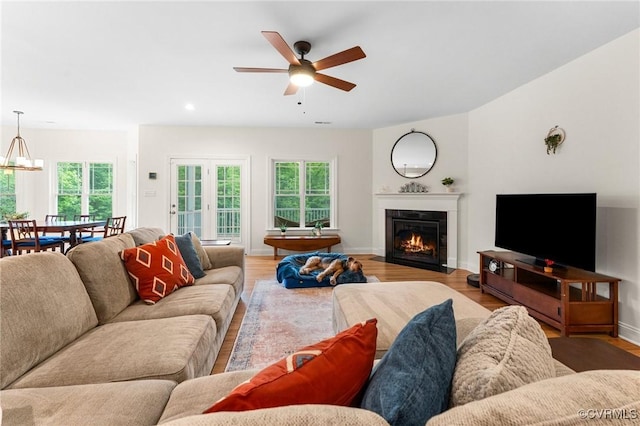 216 Edwin Cir, Aylett, VA 23009 - living room featuring a ceiling fan, healthy amount of natural light, a fireplace with flush hearth, light wood finished floors, and recessed lighting