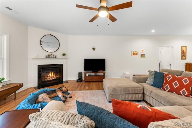 216 Edwin Cir, Aylett, VA 23009 - living room featuring ceiling fan, wood finished floors, a fireplace with flush hearth, and recessed lighting