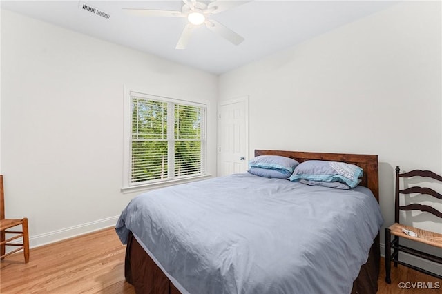216 Edwin Cir, Aylett, VA 23009 - bedroom with baseboards, light wood-style floors, a ceiling fan, and a baseboard heating unit