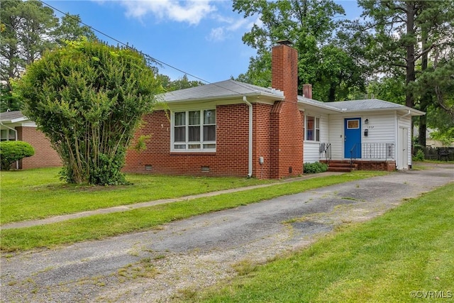 1939 Burks St, Petersburg, VA 23805 - ranch-style house featuring a chimney, a front yard, crawl space, brick siding, and driveway