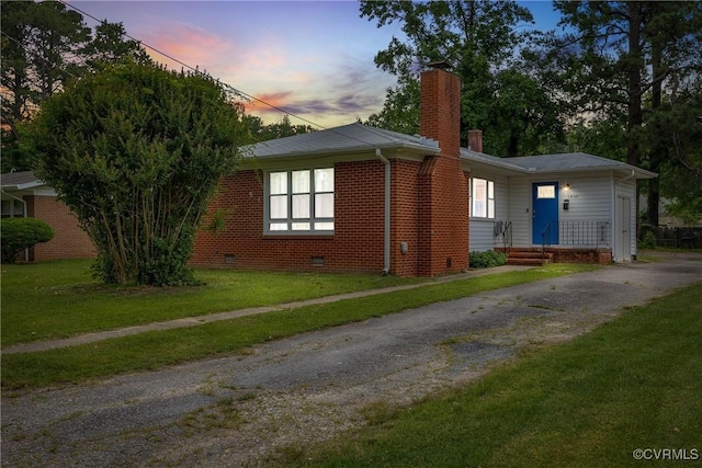 1939 Burks St, Petersburg, VA 23805 - view of front of home featuring a chimney, crawl space, a lawn, brick siding, and driveway