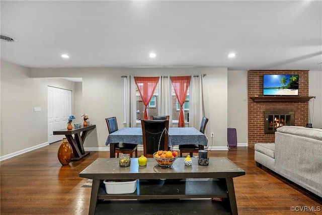 1939 Burks St, Petersburg, VA 23805 - dining space with baseboards, dark wood-type flooring, a fireplace, and recessed lighting