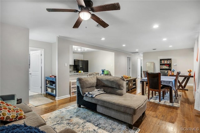 1939 Burks St, Petersburg, VA 23805 - living room with wood finished floors, recessed lighting, a ceiling fan, and baseboards
