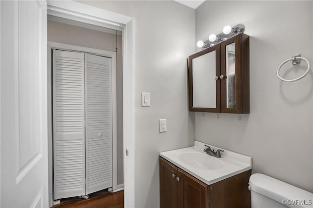 1939 Burks St, Petersburg, VA 23805 - half bath featuring a closet, vanity, toilet, and wood finished floors