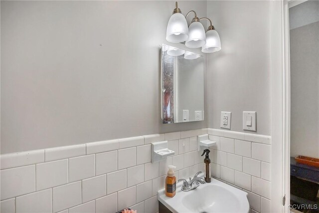 1939 Burks St, Petersburg, VA 23805 - half bath featuring a sink, tile walls, and wainscoting