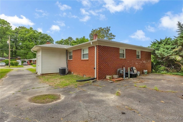1939 Burks St, Petersburg, VA 23805 - view of property exterior with brick siding and central air condition unit