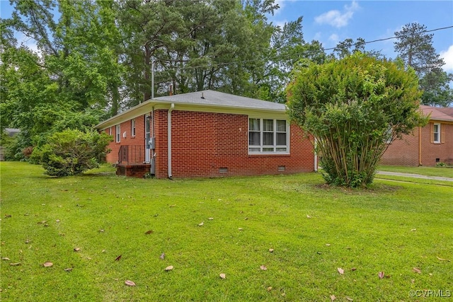 1939 Burks St, Petersburg, VA 23805 - view of side of property with a yard, crawl space, and brick siding