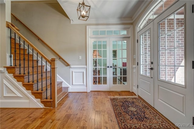 12700 Dell Hill Ct, Chester, VA 23831 - entrance foyer with french doors, stairway, wood finished floors, a chandelier, and crown molding