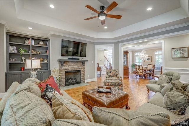 12700 Dell Hill Ct, Chester, VA 23831 - living area featuring a tray ceiling, ornamental molding, ceiling fan, a fireplace, and a chandelier