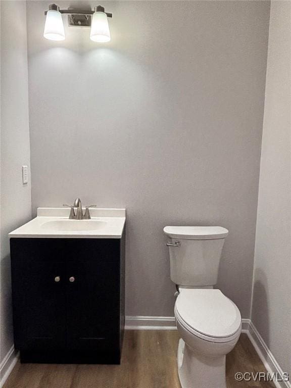 7906 Battlefield Park Rd, Henrico, VA 23231 - half bath featuring vanity and wood finished floors