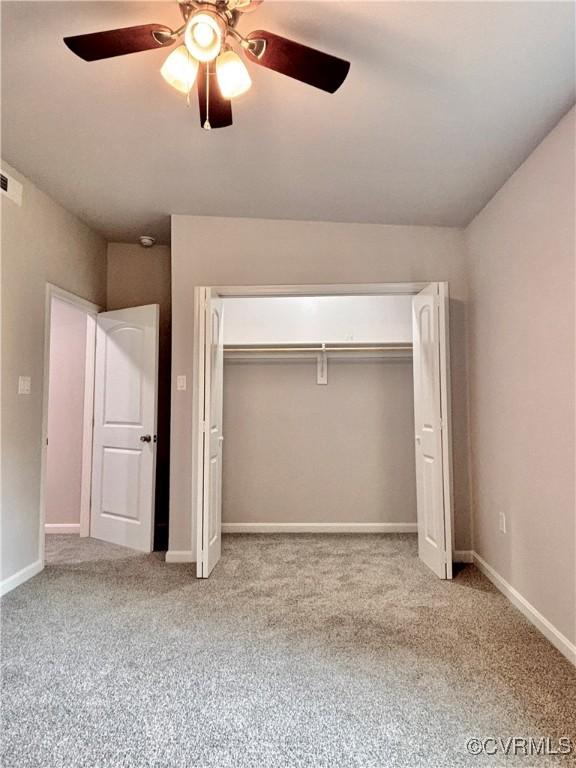 7906 Battlefield Park Rd, Henrico, VA 23231 - unfurnished bedroom featuring carpet floors, a closet, and a ceiling fan