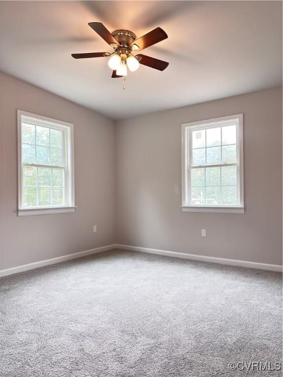 7906 Battlefield Park Rd, Henrico, VA 23231 - carpeted spare room with baseboards and a ceiling fan