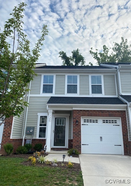 120 De La Warr Arch, Williamsburg, VA 23185 - view of front of property featuring brick siding, driveway, and an attached garage