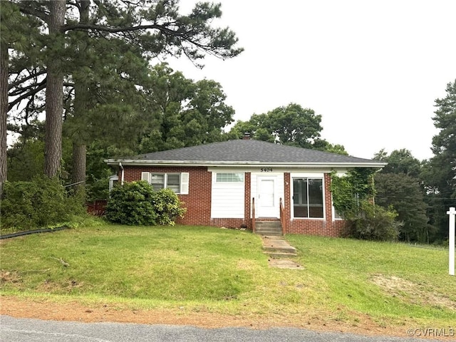 5404 Oak St, North Dinwiddie, VA 23803 - view of front of home featuring brick siding, a front lawn, and entry steps