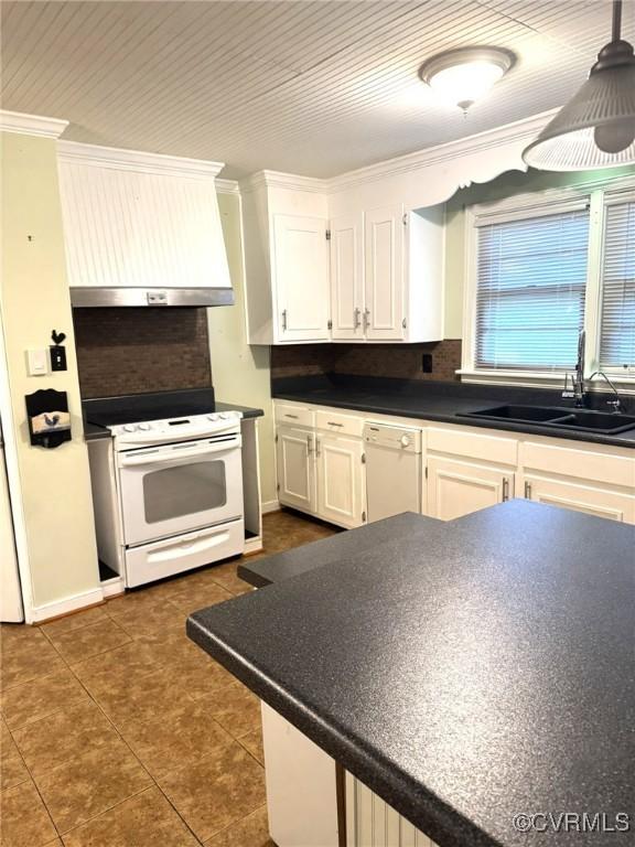 5404 Oak St, North Dinwiddie, VA 23803 - kitchen with a sink, white appliances, ornamental molding, white cabinetry, and dark countertops