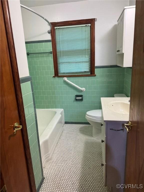 5404 Oak St, North Dinwiddie, VA 23803 - full bath featuring tile walls, tile patterned floors, wainscoting, and vanity