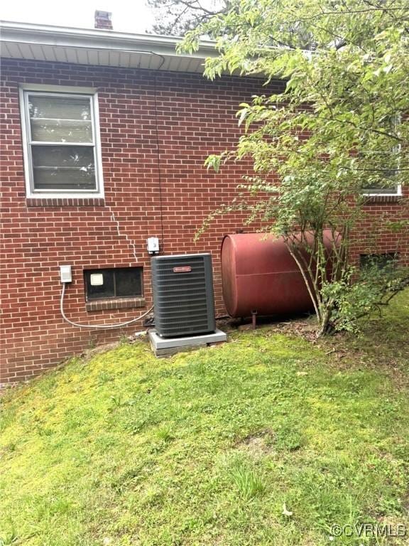 5404 Oak St, North Dinwiddie, VA 23803 - exterior view of oil tank and brick siding