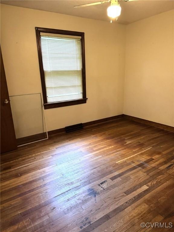 5404 Oak St, North Dinwiddie, VA 23803 - spare room featuring dark wood finished floors and ceiling fan
