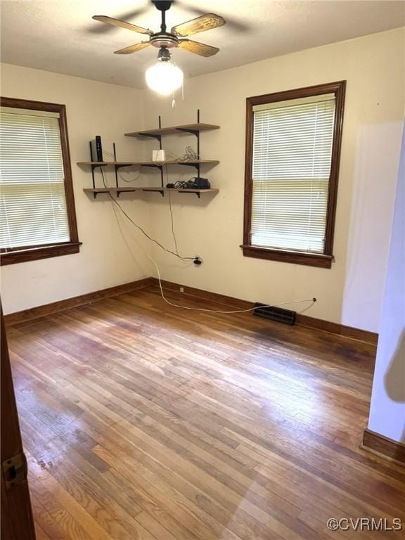 5404 Oak St, North Dinwiddie, VA 23803 - spare room featuring wood finished floors and ceiling fan