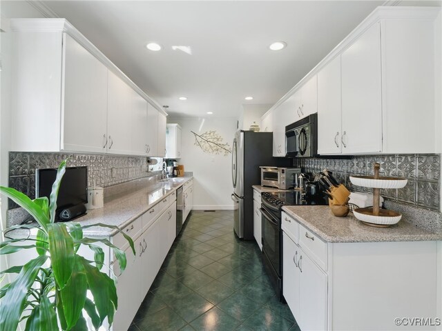 12503 Winchester Green Ct, Henrico, VA 23233 - kitchen with black appliances, tasteful backsplash, white cabinets, and recessed lighting