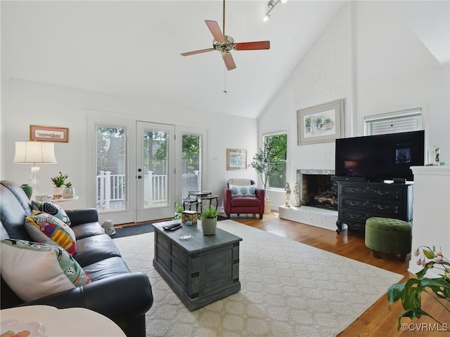 12503 Winchester Green Ct, Henrico, VA 23233 - living room featuring wood finished floors, ceiling fan, high vaulted ceiling, a fireplace, and track lighting