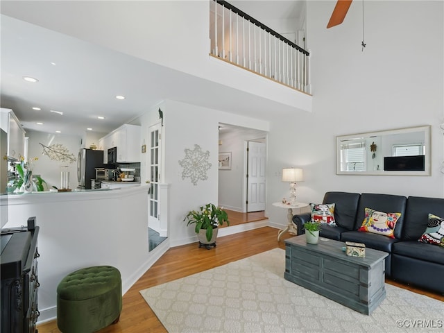12503 Winchester Green Ct, Henrico, VA 23233 - living room with light wood-style floors, a ceiling fan, recessed lighting, and a towering ceiling