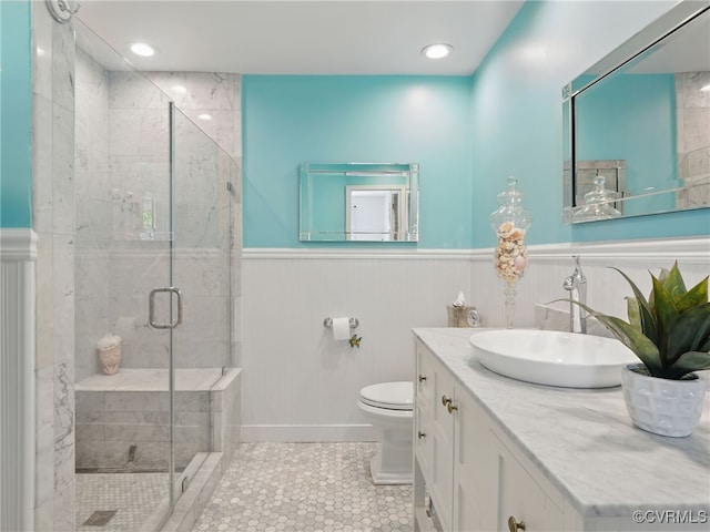 12503 Winchester Green Ct, Henrico, VA 23233 - bathroom with a stall shower, vanity, a wainscoted wall, and tile patterned floors