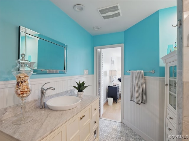 12503 Winchester Green Ct, Henrico, VA 23233 - bathroom featuring wainscoting, vanity, and tile patterned flooring