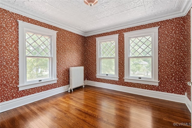 2707 Sherbourne Rd, Chesterfield, VA 23237 - empty room with radiator, plenty of natural light, hardwood / wood-style flooring, ornamental molding, and an ornate ceiling
