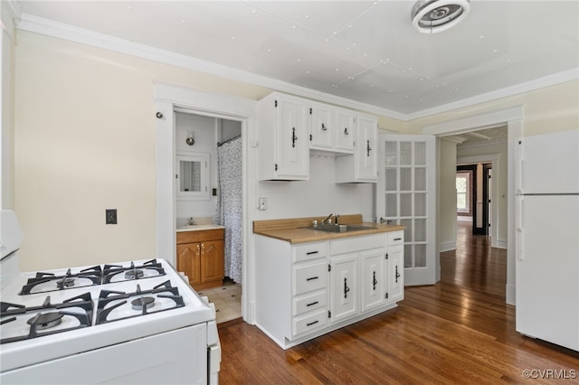 2707 Sherbourne Rd, Chesterfield, VA 23237 - kitchen with white appliances, dark wood-style floors, white cabinetry, light countertops, and crown molding