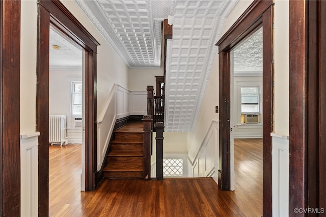 2707 Sherbourne Rd, Chesterfield, VA 23237 - stairway with radiator, a decorative wall, hardwood / wood-style flooring, ornamental molding, and cooling unit