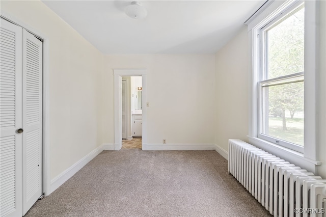 2707 Sherbourne Rd, Chesterfield, VA 23237 - unfurnished bedroom with radiator, light carpet, and a closet