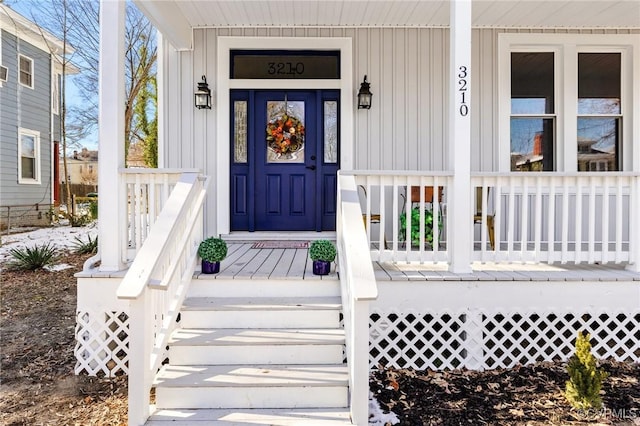 3210 3rd Ave, Richmond, VA 23222 - property entrance featuring covered porch and board and batten siding