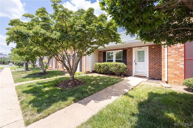 8406 Shannon Green Ct, Henrico, VA 23228 - obstructed view of property featuring brick siding and a front lawn