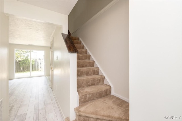 8406 Shannon Green Ct, Henrico, VA 23228 - stairway featuring baseboards and wood finished floors