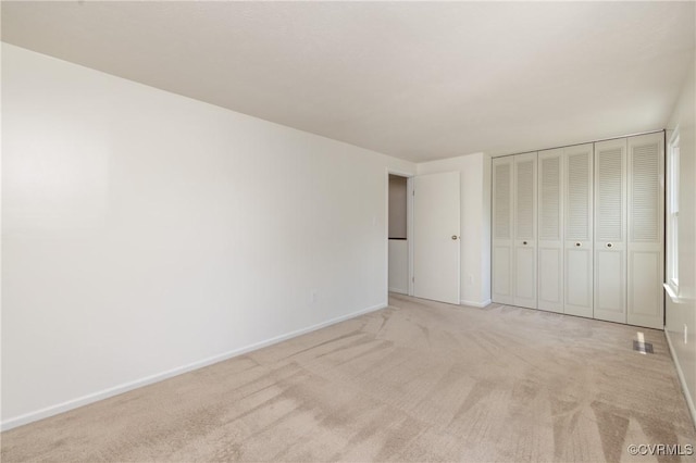 8406 Shannon Green Ct, Henrico, VA 23228 - unfurnished bedroom with light carpet and a closet