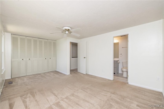 8406 Shannon Green Ct, Henrico, VA 23228 - unfurnished bedroom with light carpet, connected bathroom, and a ceiling fan