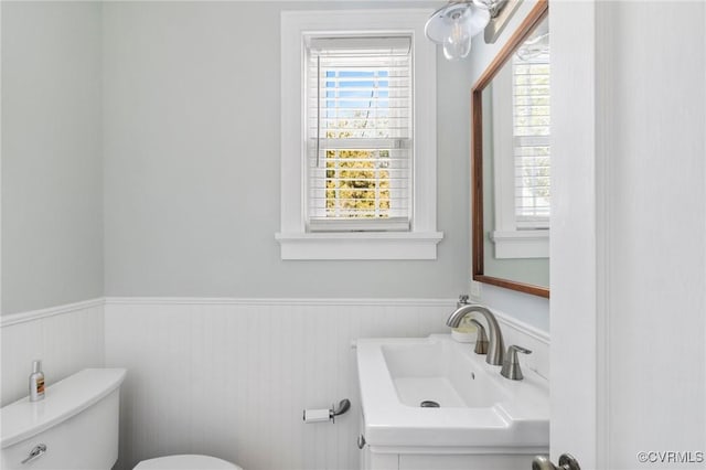 4100 Patterson Ave, Richmond, VA 23221 - half bath with healthy amount of natural light, a wainscoted wall, and vanity