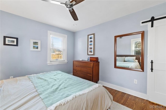 4100 Patterson Ave, Richmond, VA 23221 - bedroom featuring a barn door, wood finished floors, and ceiling fan