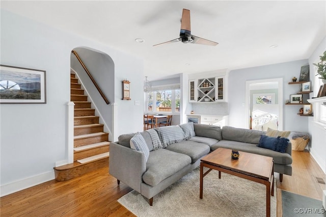 4100 Patterson Ave, Richmond, VA 23221 - living room with light wood finished floors, stairs, and a ceiling fan