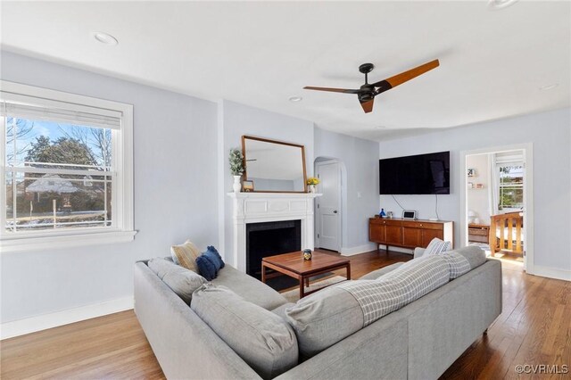 4100 Patterson Ave, Richmond, VA 23221 - living area with arched walkways, a ceiling fan, wood finished floors, a fireplace, and recessed lighting