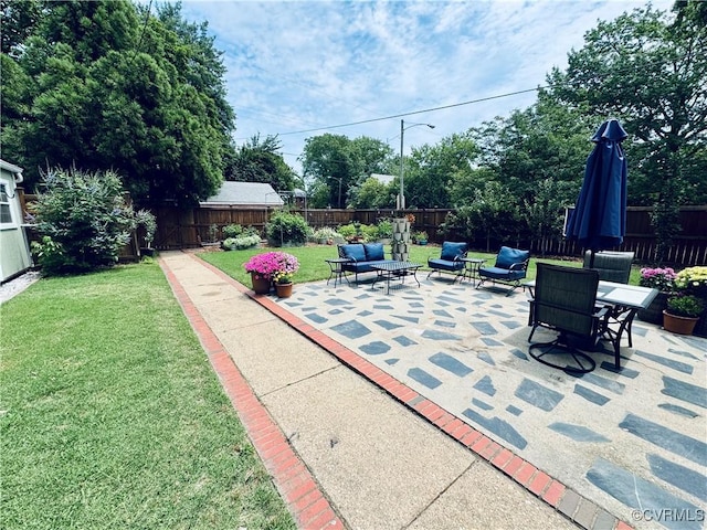 4100 Patterson Ave, Richmond, VA 23221 - fenced backyard featuring a patio and outdoor lounge area