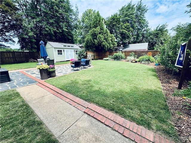 4100 Patterson Ave, Richmond, VA 23221 - fenced backyard with a patio area and a storage unit